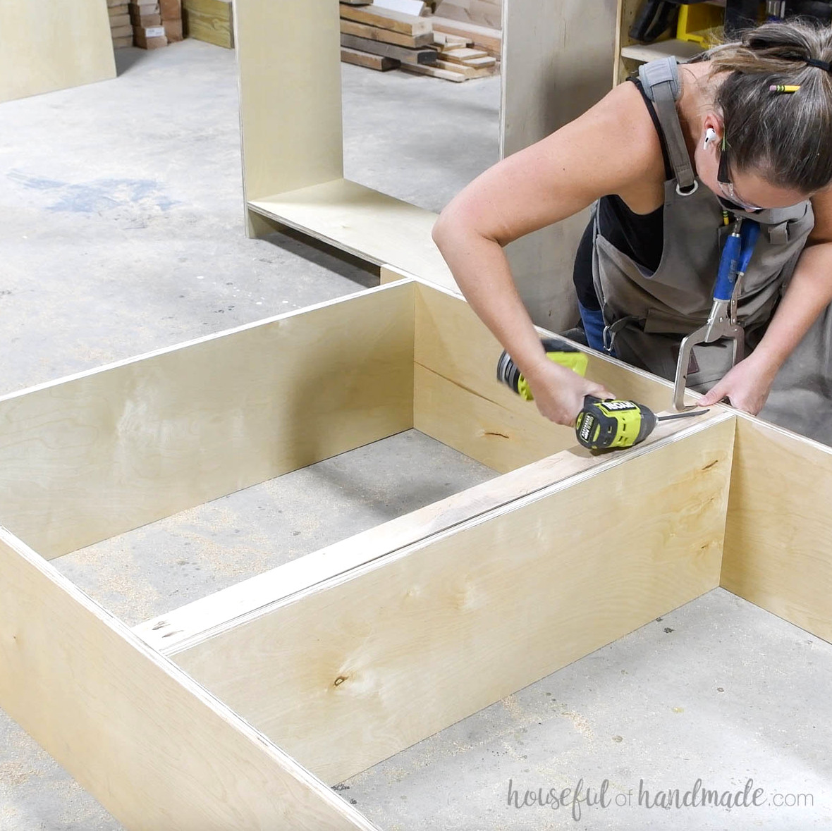 Installing a brace beneath the fixed bookcase shelf.