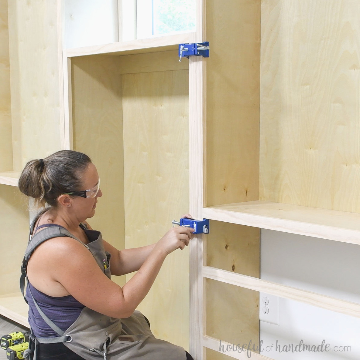 Joining the cabinets with cabinet clamps. 