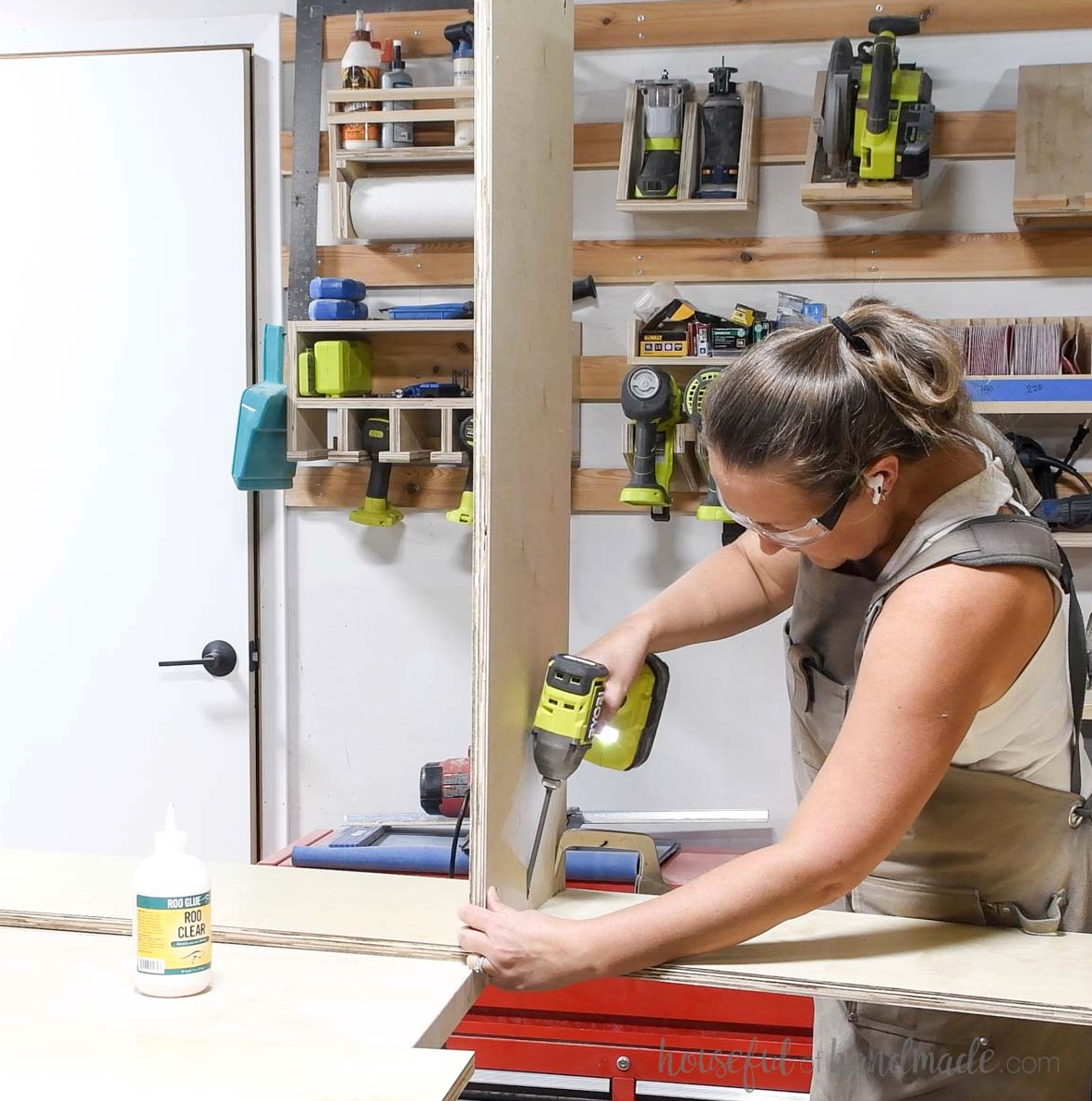 Securing the stationary center shelf to the side. 