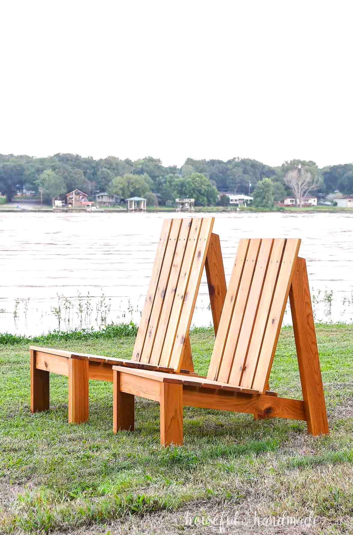A standard and XL modern outdoor chair made from cedar positioned side by side.