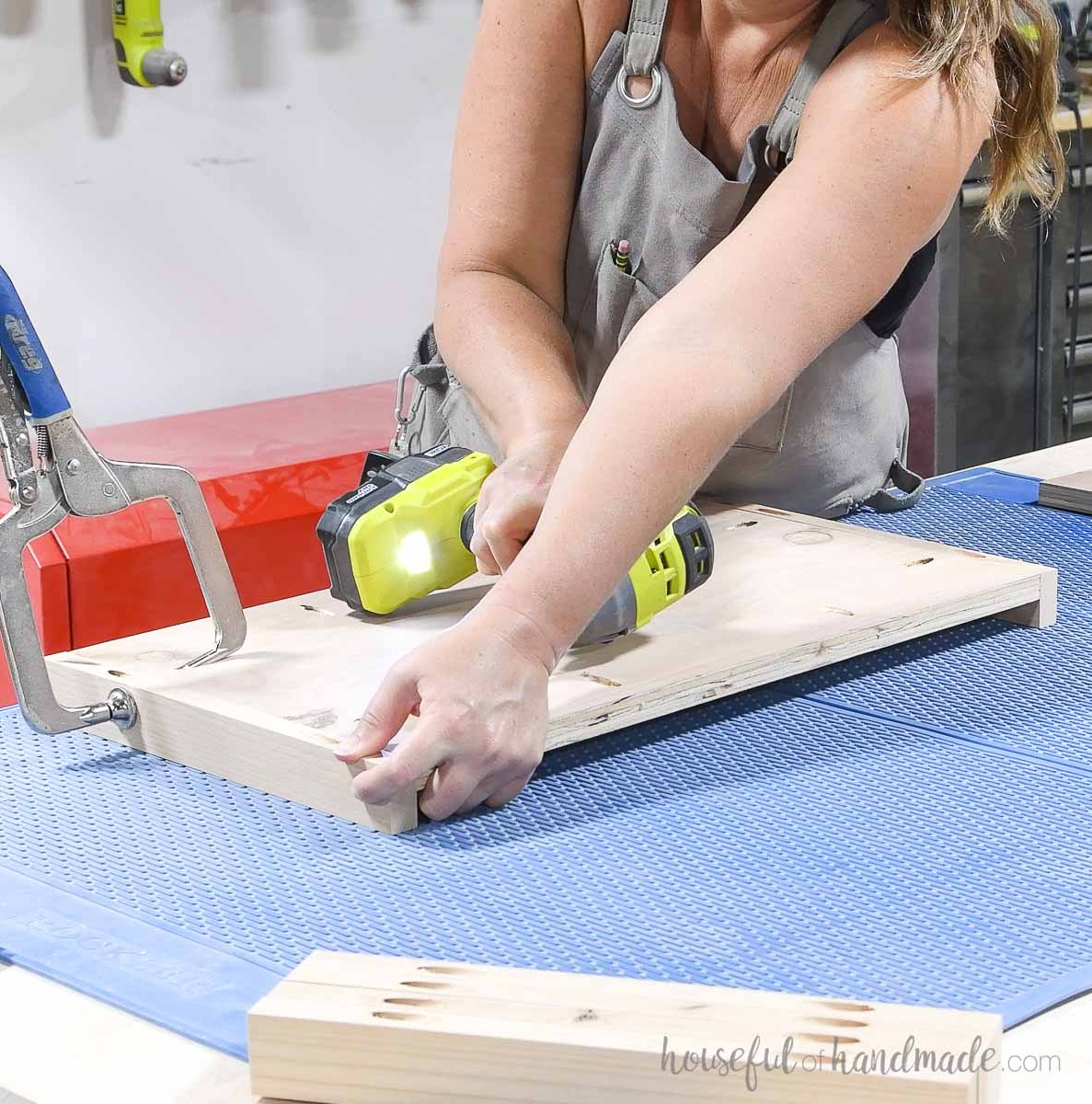 Securing trim to the upper and lower parts of the plywood side.