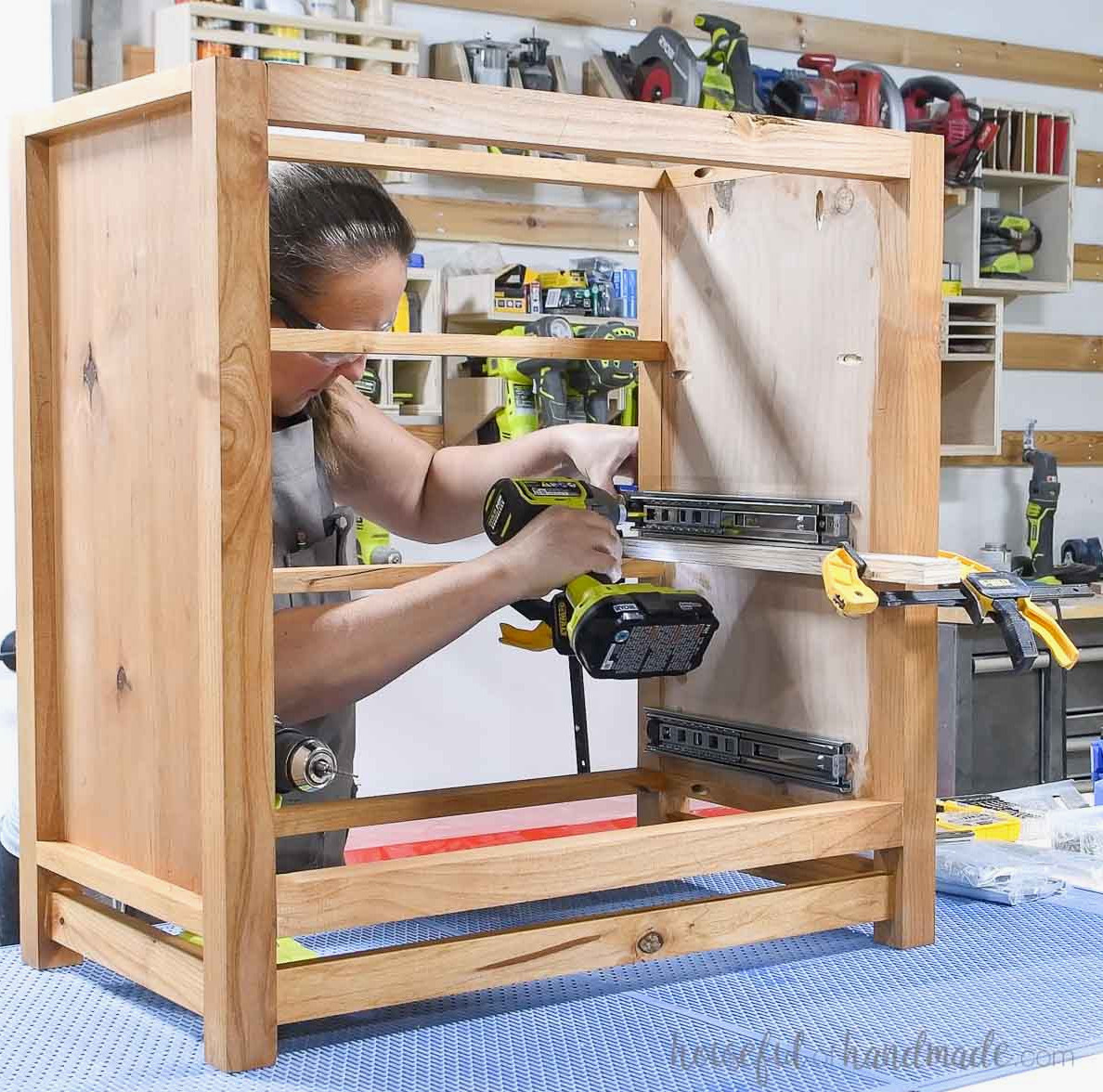 Fastening drawer slides to the nightstand frame’s side.