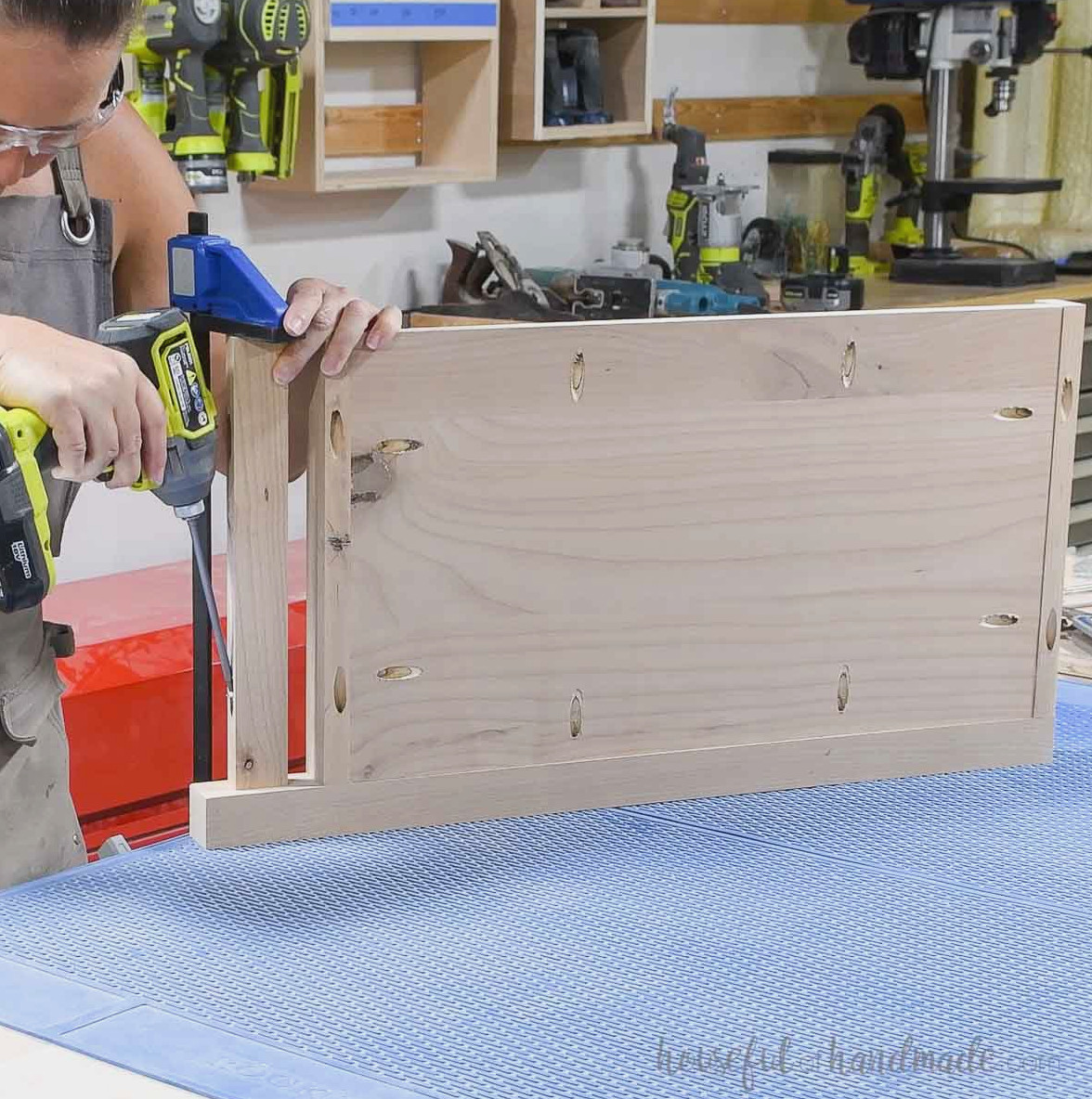 Fastening the leg to one side with a decorative lower trim piece.