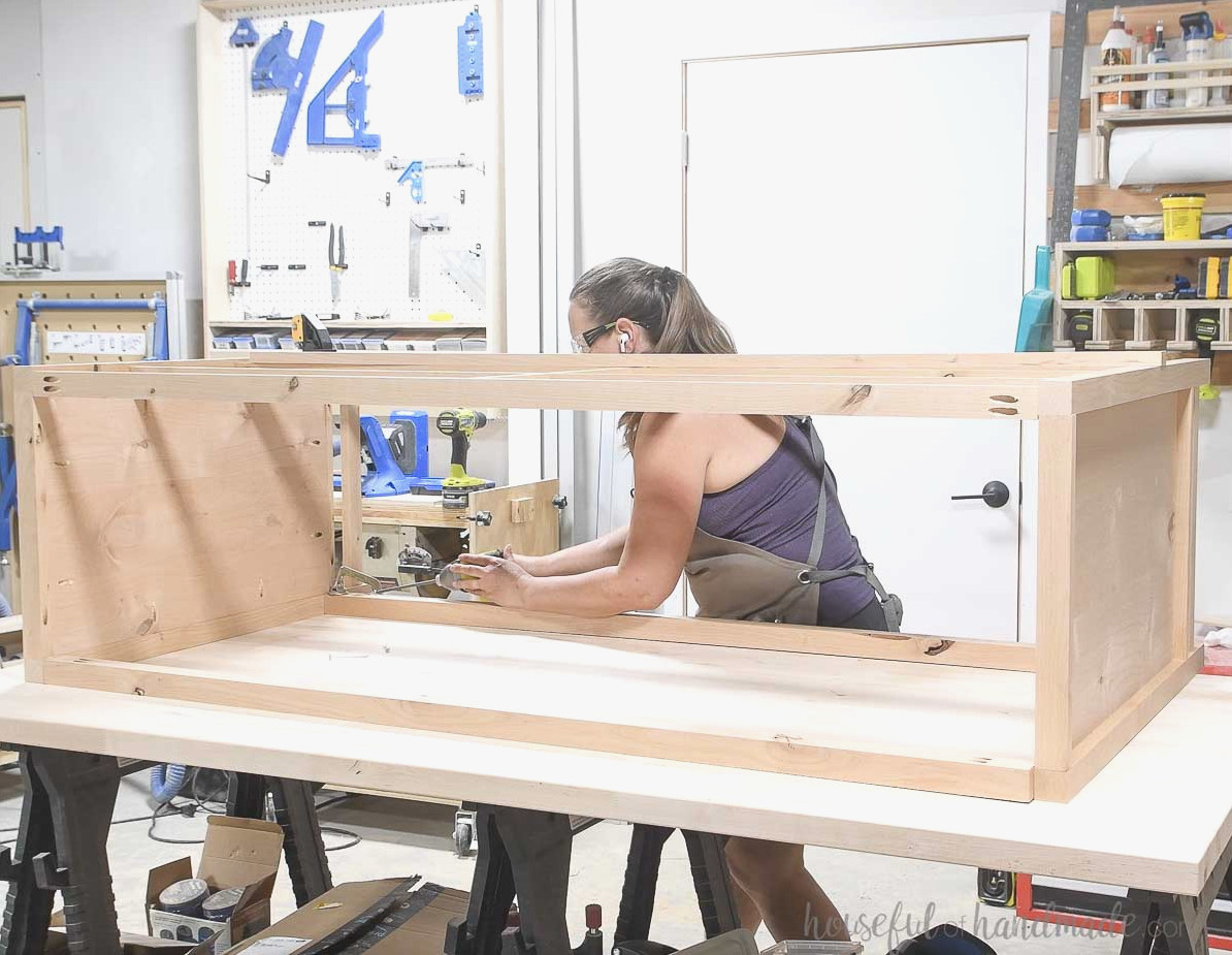 Installing the back pieces to finish the dresser frame.