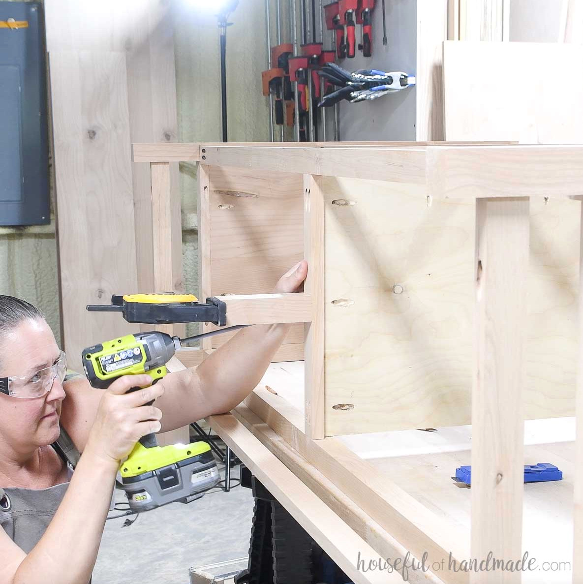 Securing the center leg to the dresser frame.