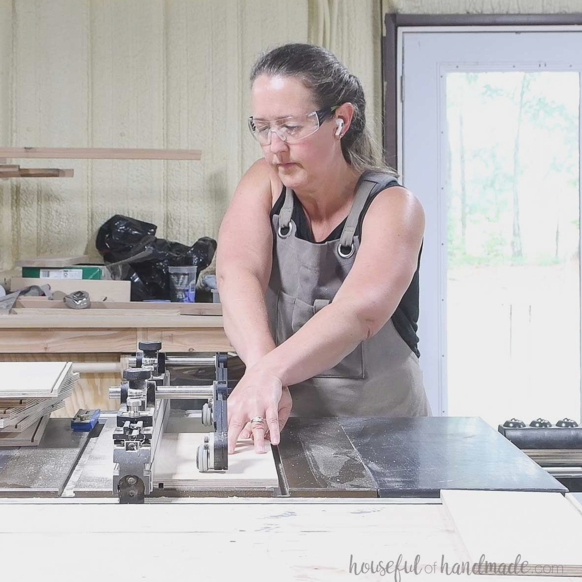 Cutting a groove in the drawer box pieces with a table saw. 