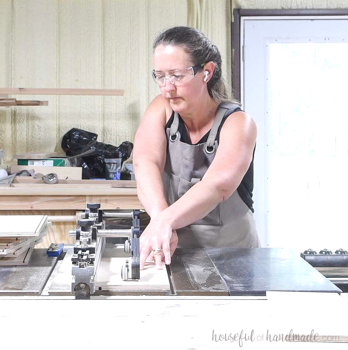 Cutting a groove in the drawer box pieces with a table saw.