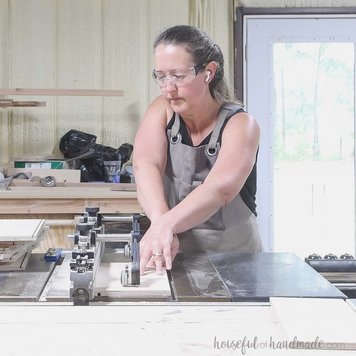 Making a groove in the drawer box pieces with a table saw.