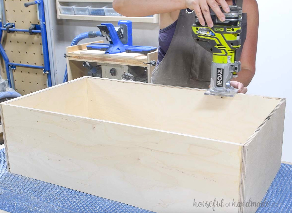 Rounding over the inside of the drawer box with a router. 