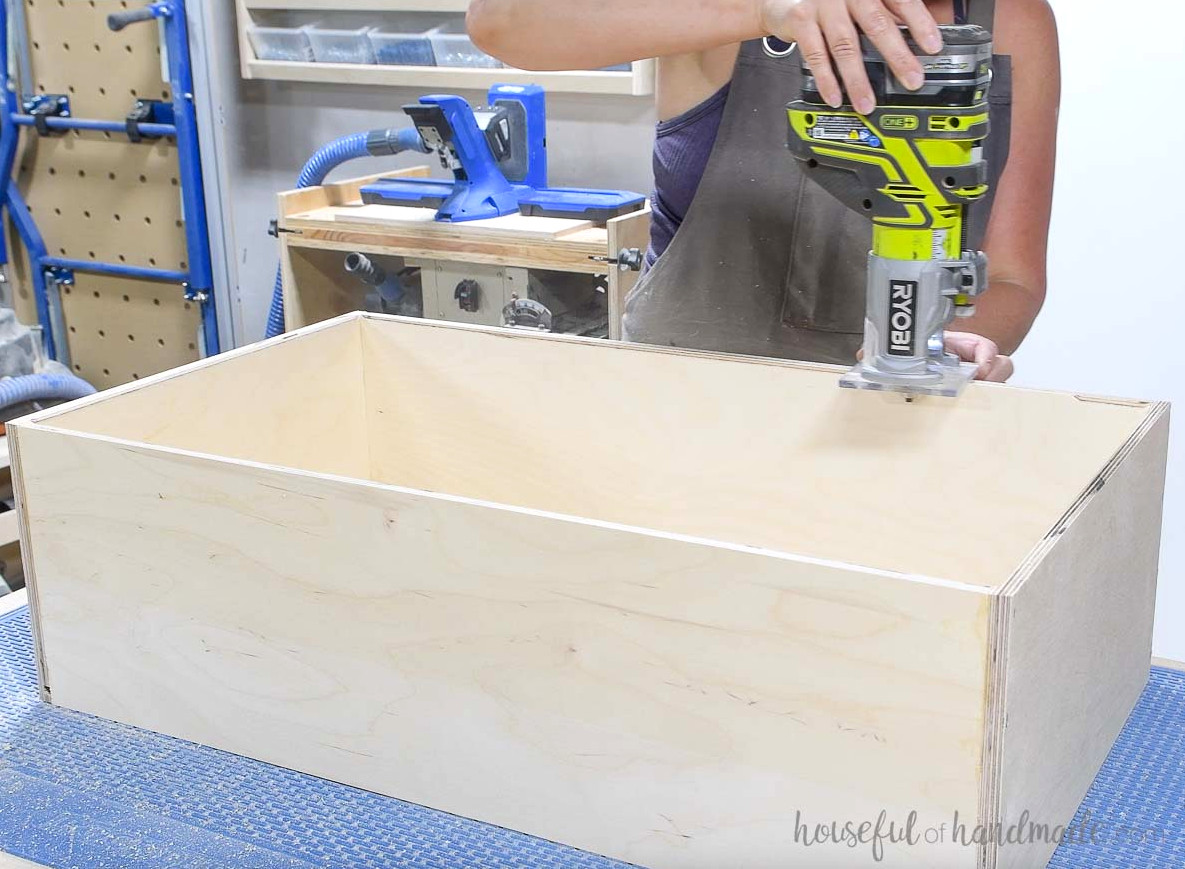 Rounding over the inside of the drawer box with a router.