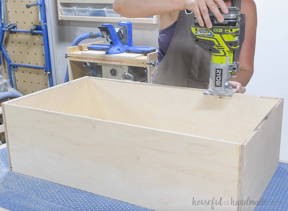 Using a router to round over the inside edge of the drawer box.
