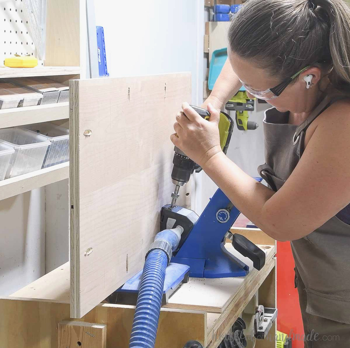 Using a Kreg jig to drill pocket holes around the side panel.