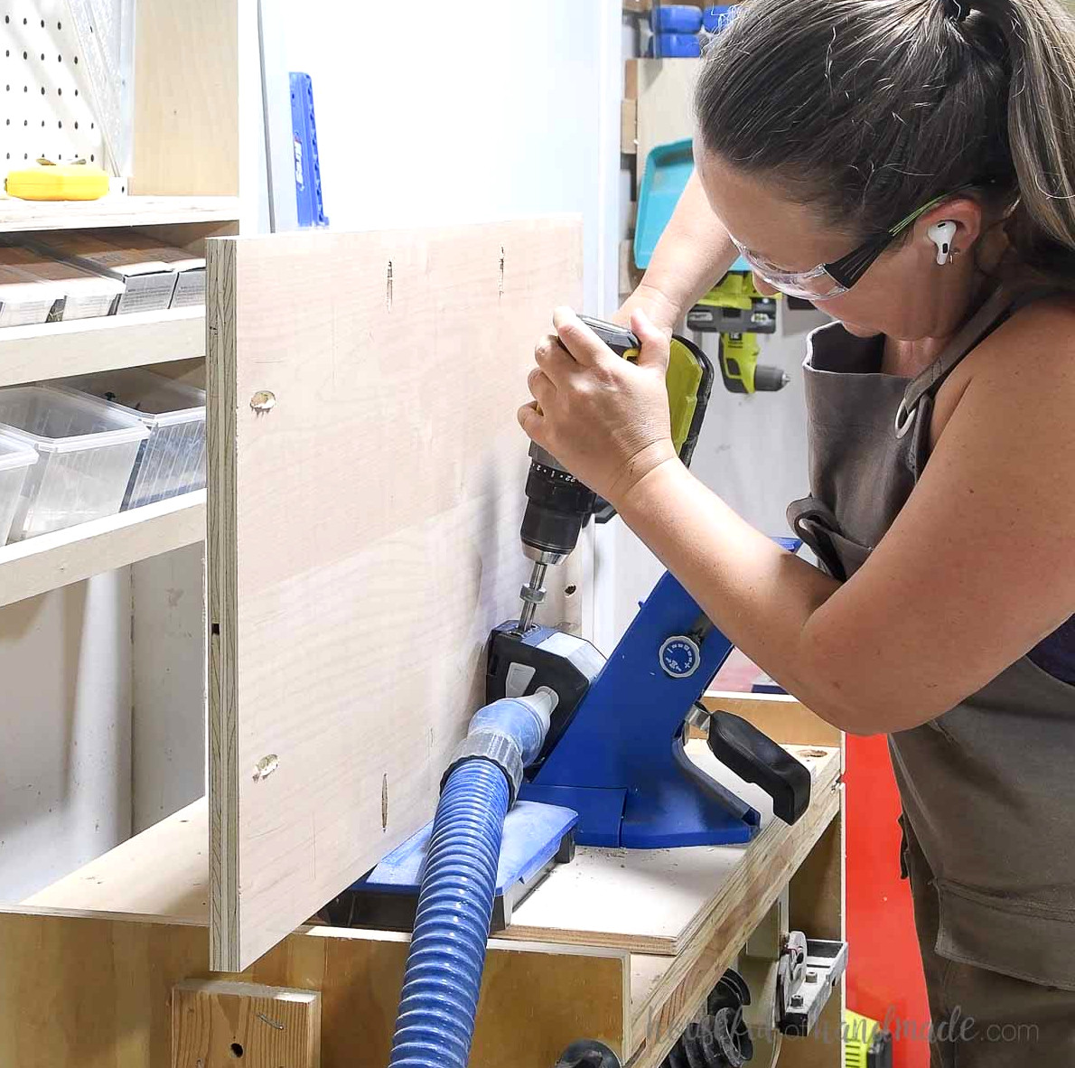 Drilling pocket holes around the side panel with the Kreg jig.