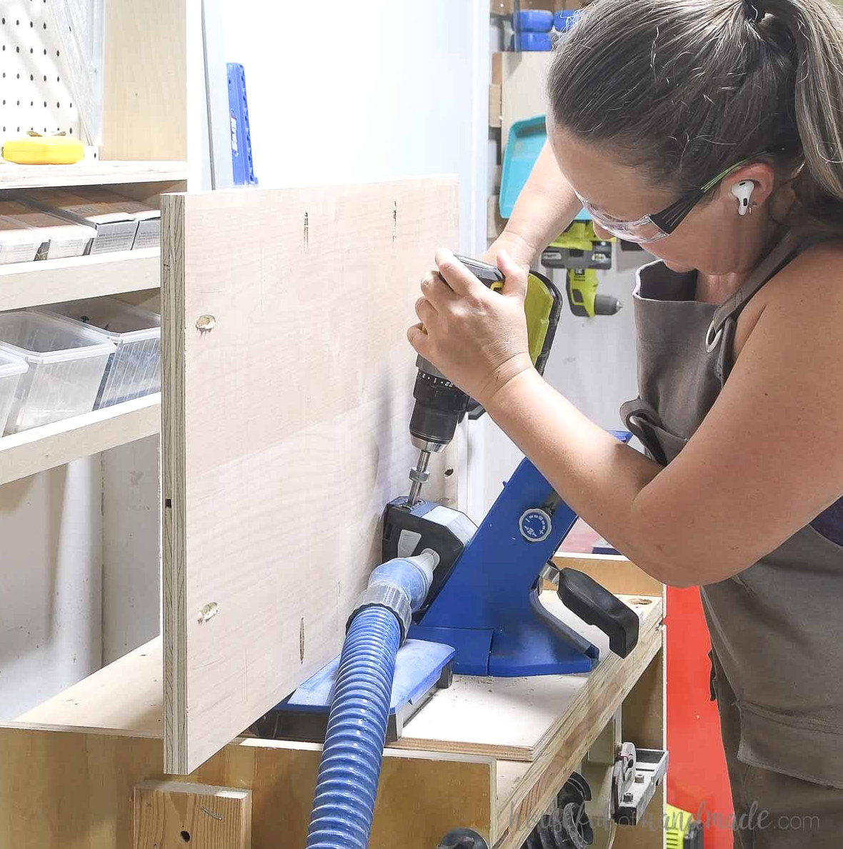 Drilling pocket holes around the side panel with the Kreg jig.
