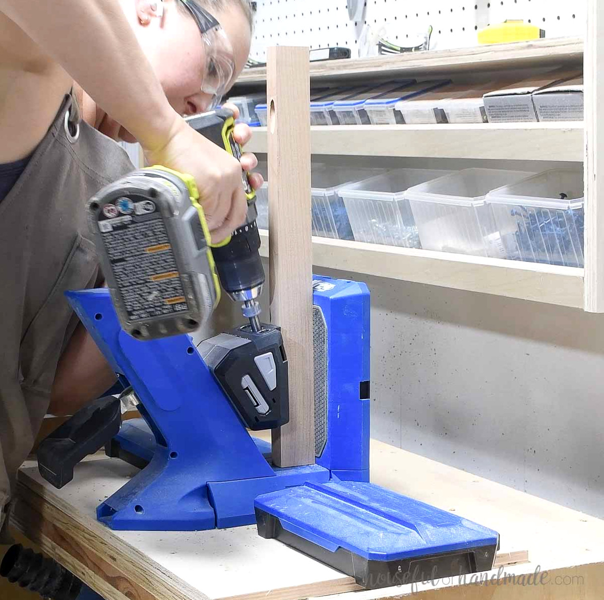 Drilling a pocket hole into the narrow side of the 1x2 board.
