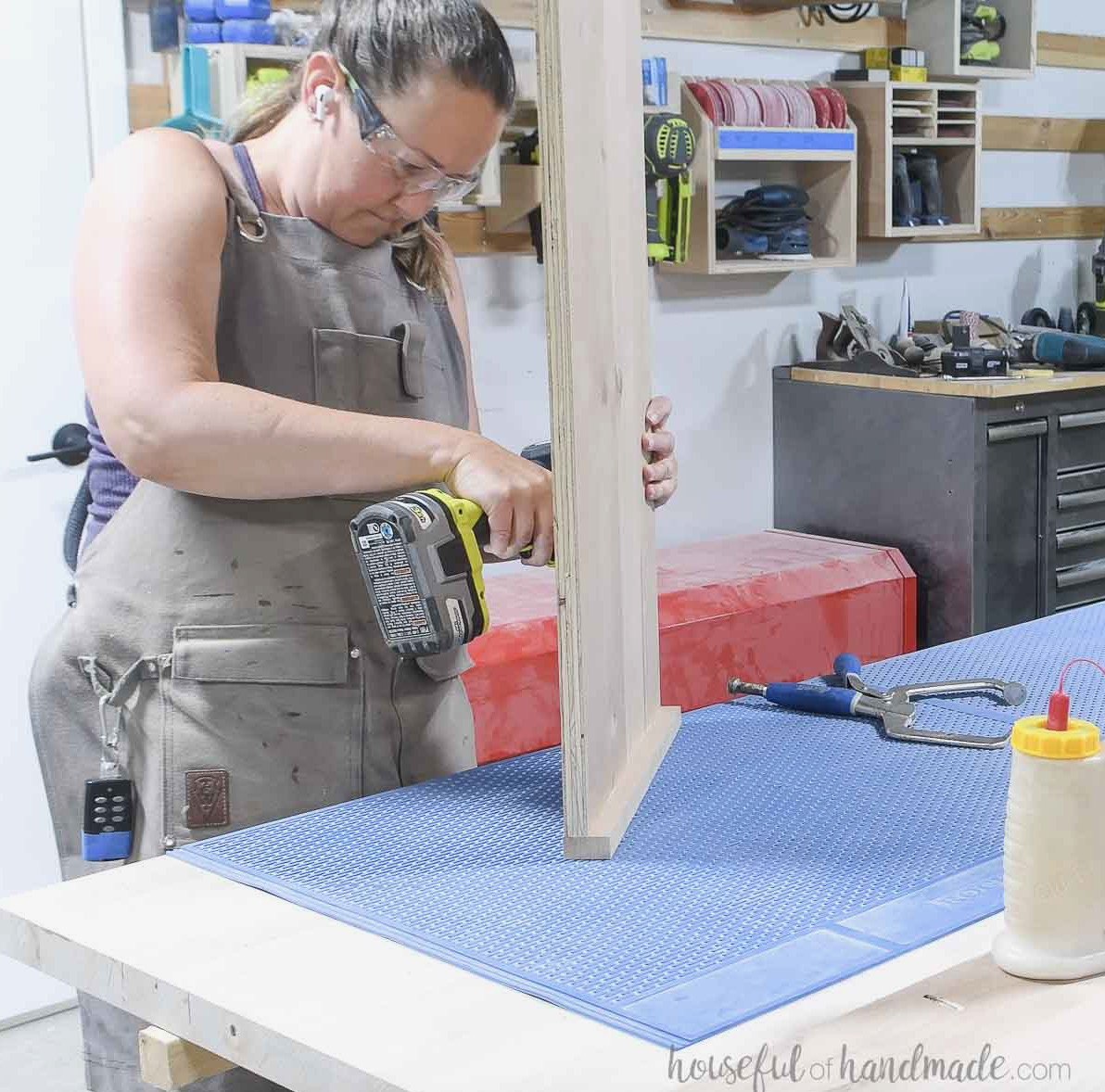 Attaching 1x2 trim boards to the side panel.