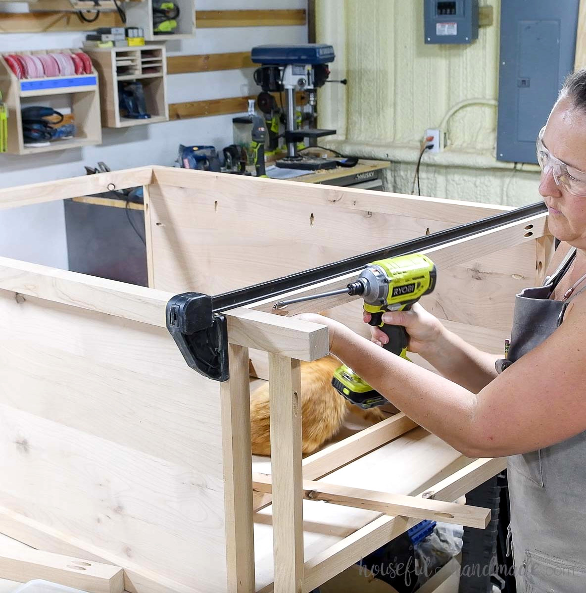 Attaching the back pieces to the dresser. 