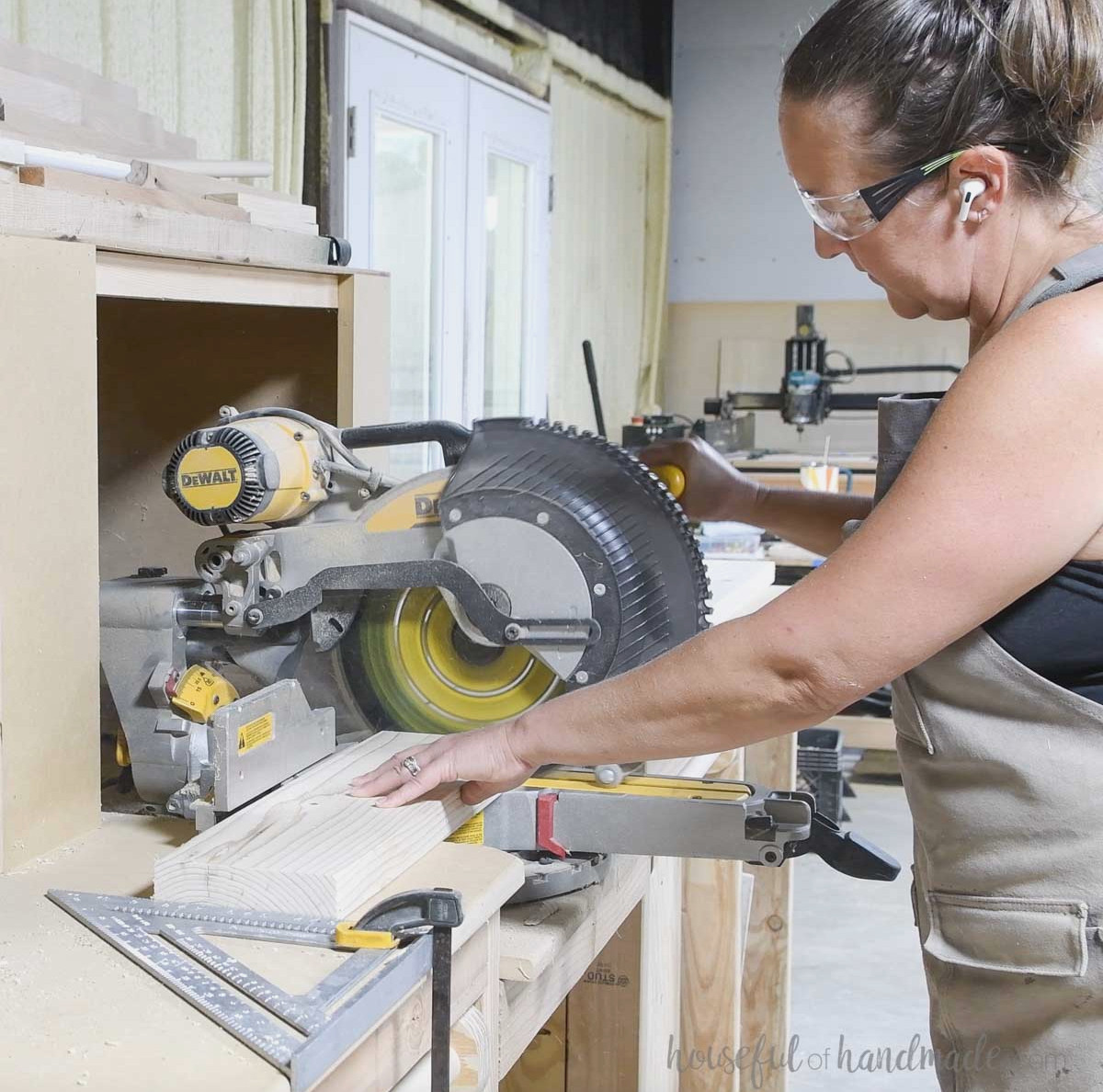 Cutting 2x6 boards with a miter saw.