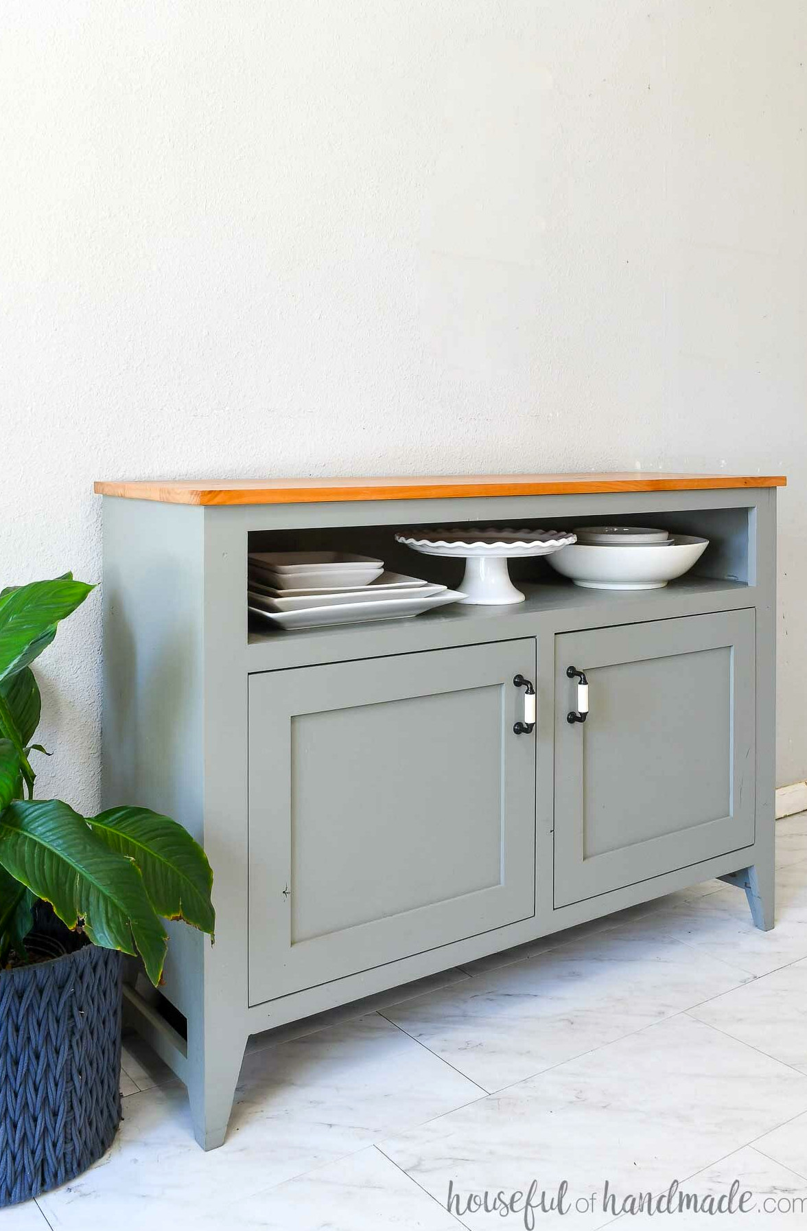Painted sideboard buffet featuring a natural alder top and a shelf for oversized dishes. 
