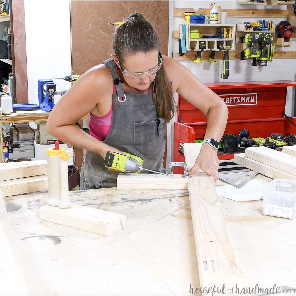 Attaching the legs to the center support rail.
