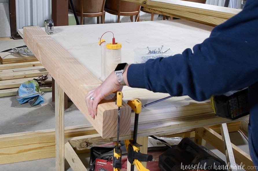 Securing the upper 2x8 headboard board with pocket holes.