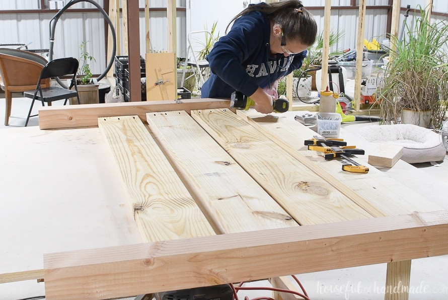 Fastening the second leg to the headboard using pocket holes.