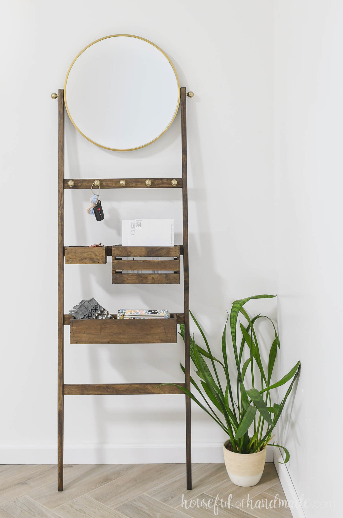 Storage ladder for the entryway with bins for mail, sunglasses and gloves.