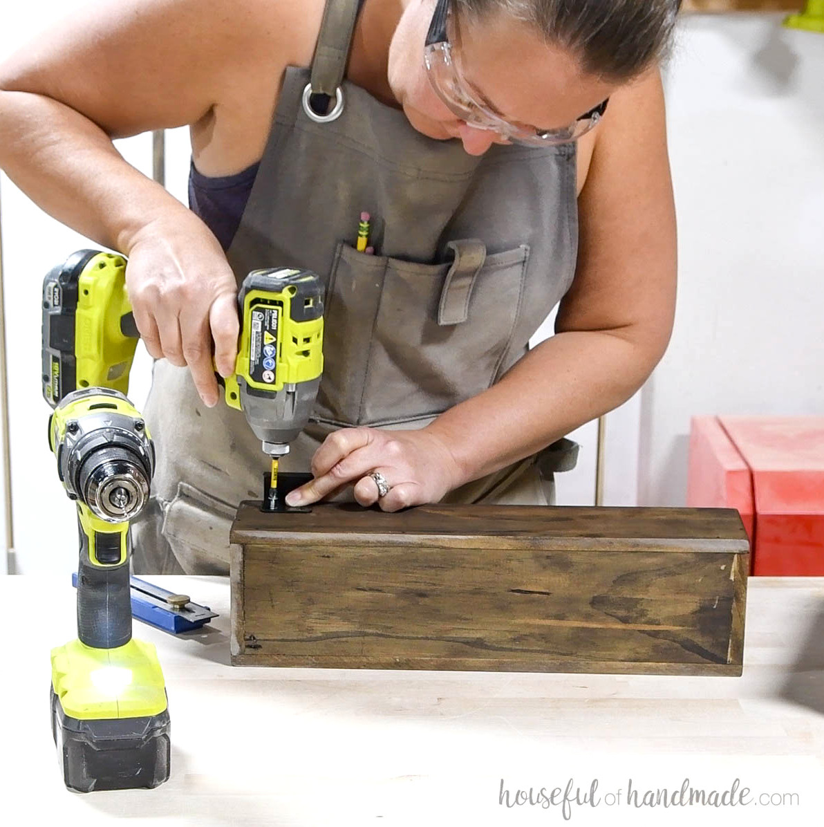 Mounting square hangers on the back of the wooden bin.