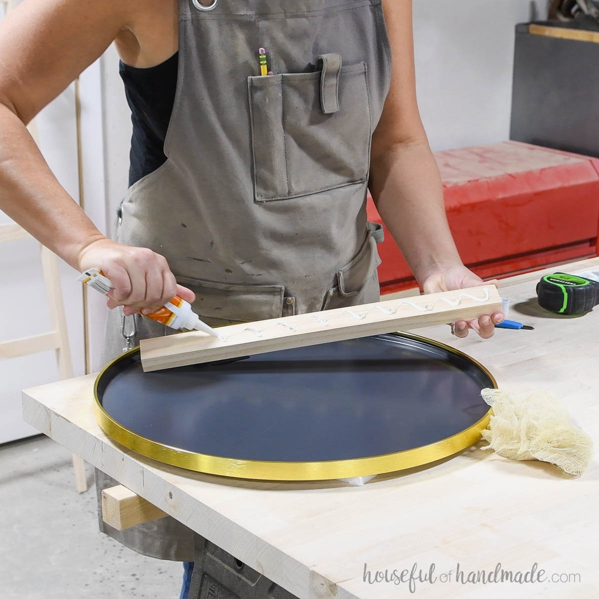Adhering the mirror to a 1x2 board.