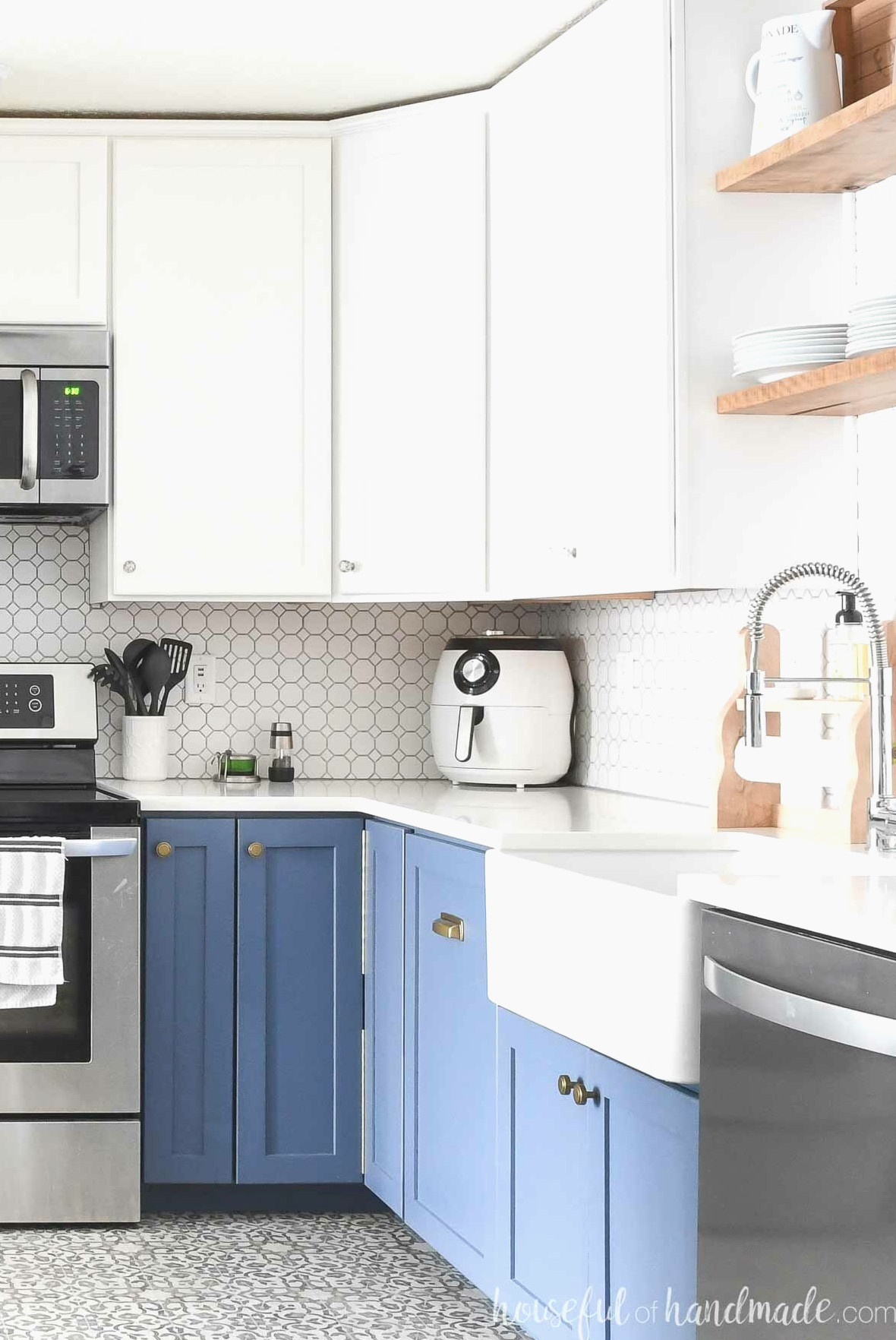DIY corner cabinets in a kitchen with blue base cabinets and white wall cabinets.