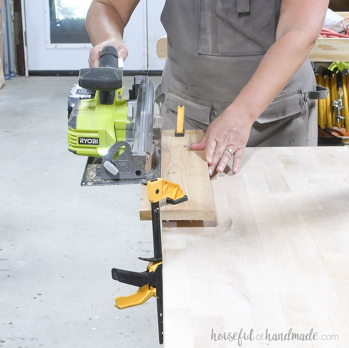 Cutting the inside edge of the seat board at an angle with a circular saw.