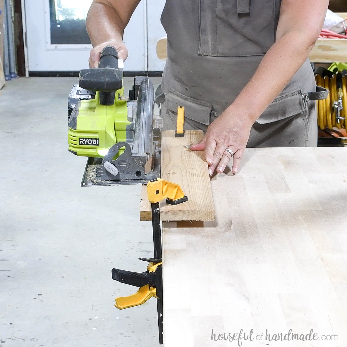 Cutting the inside edge of the seat board at an angle with a circular saw.