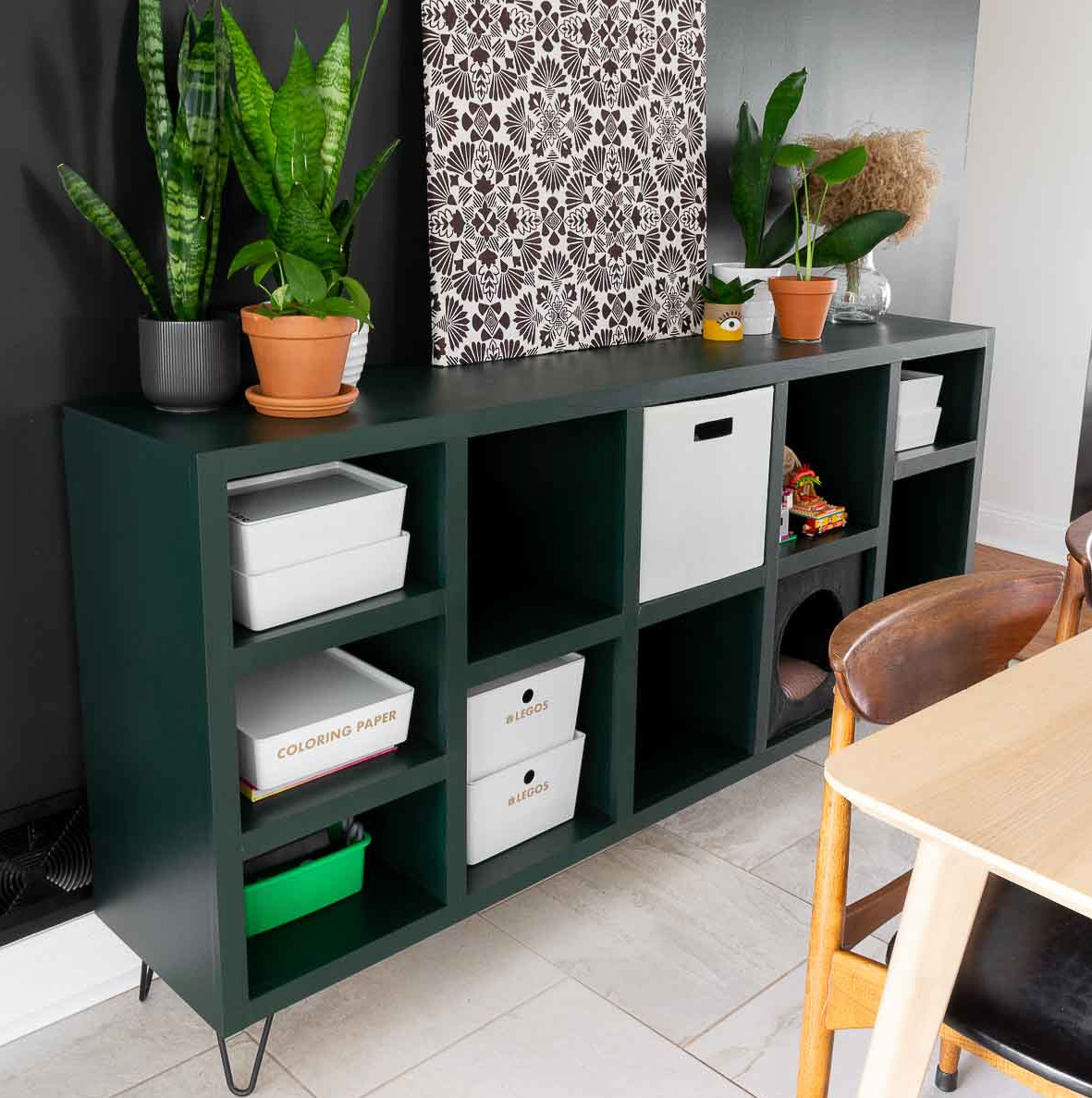 Contemporary cube storage cabinet with square cubbies, adjustable shelves, and black furniture feet.