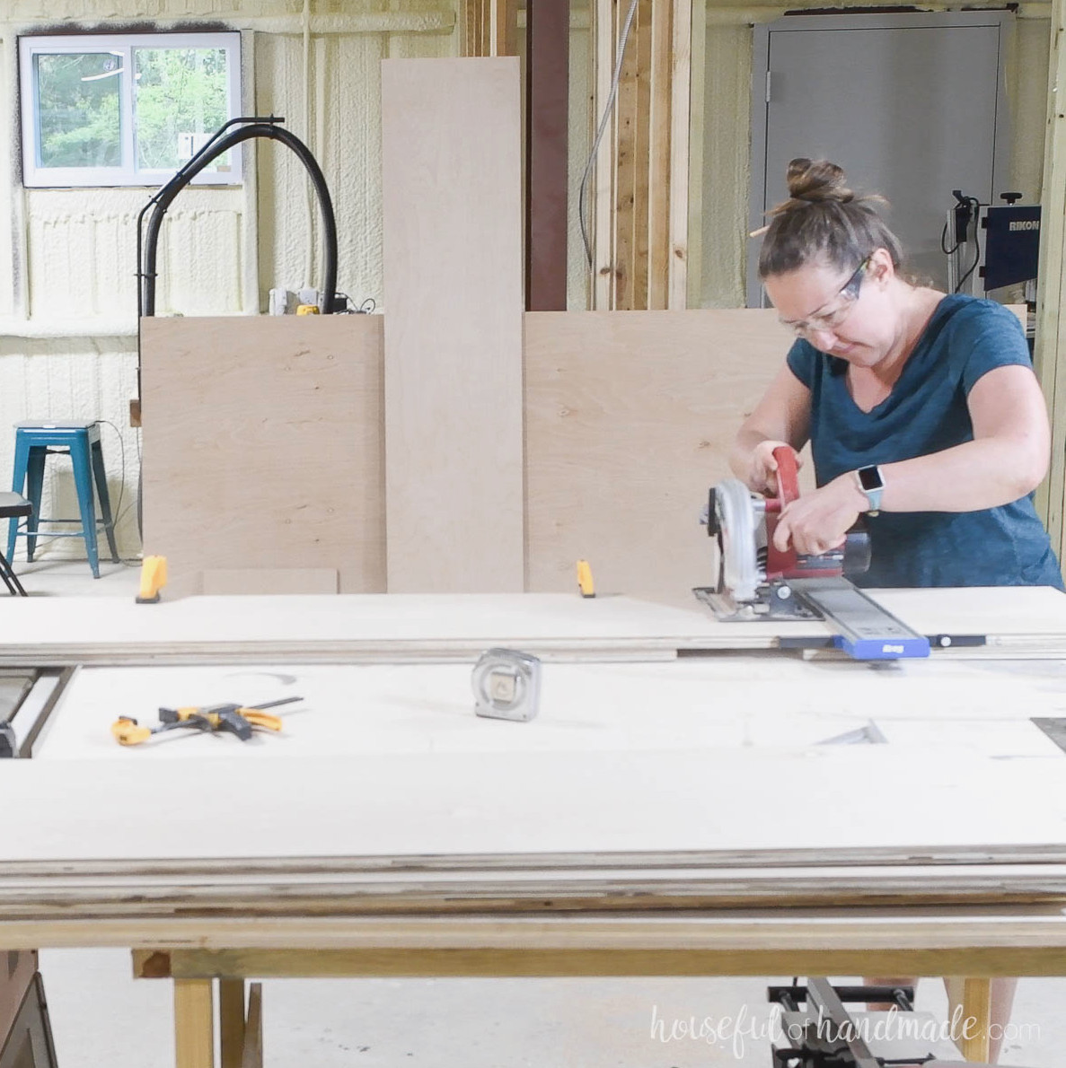 Cross cutting the plywood strips for the cabinet sides.