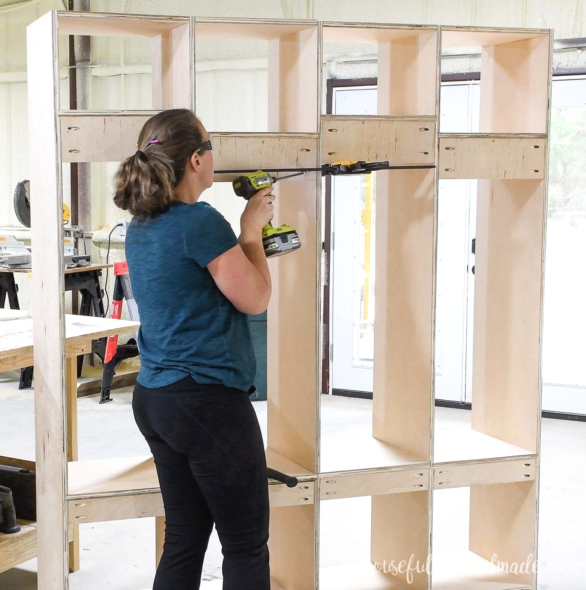Fastening the locker compartments together to create 4 completed lockers in the cabinet.