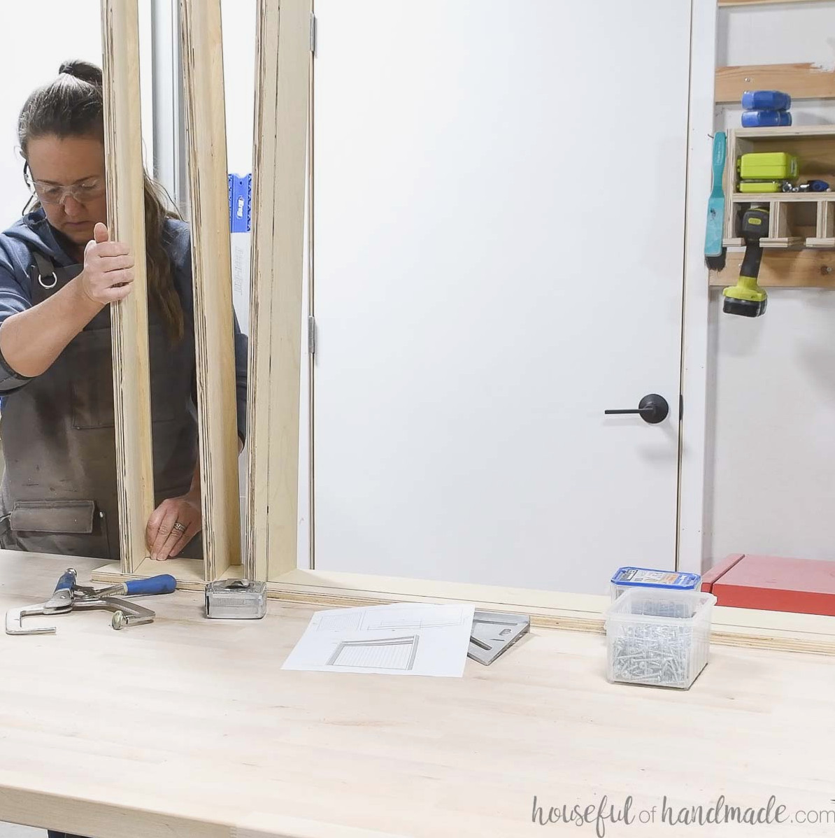 Attaching the lower shelves to the cabinet frame. 