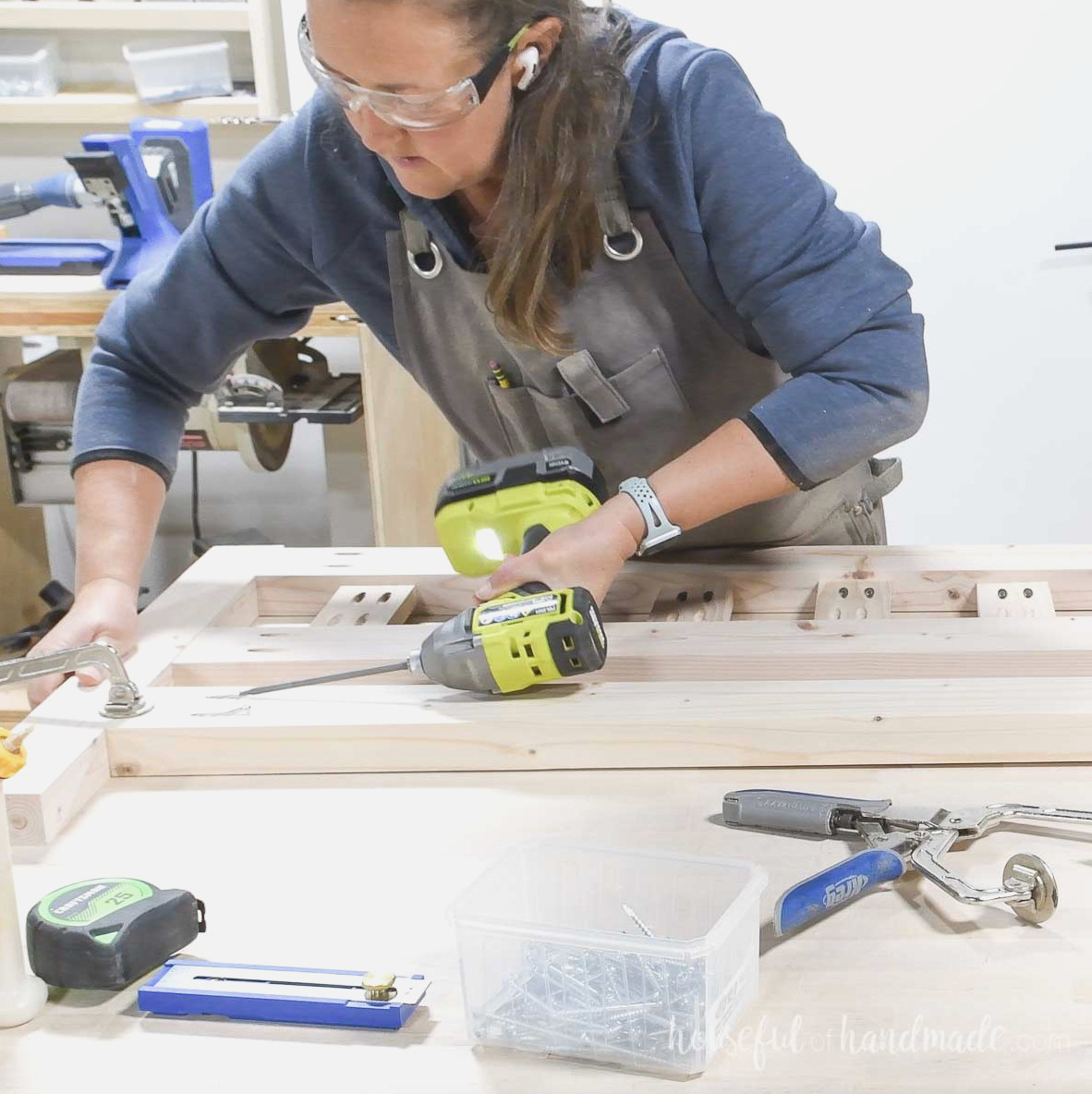 Attaching the legs to the platform bed footboard. 