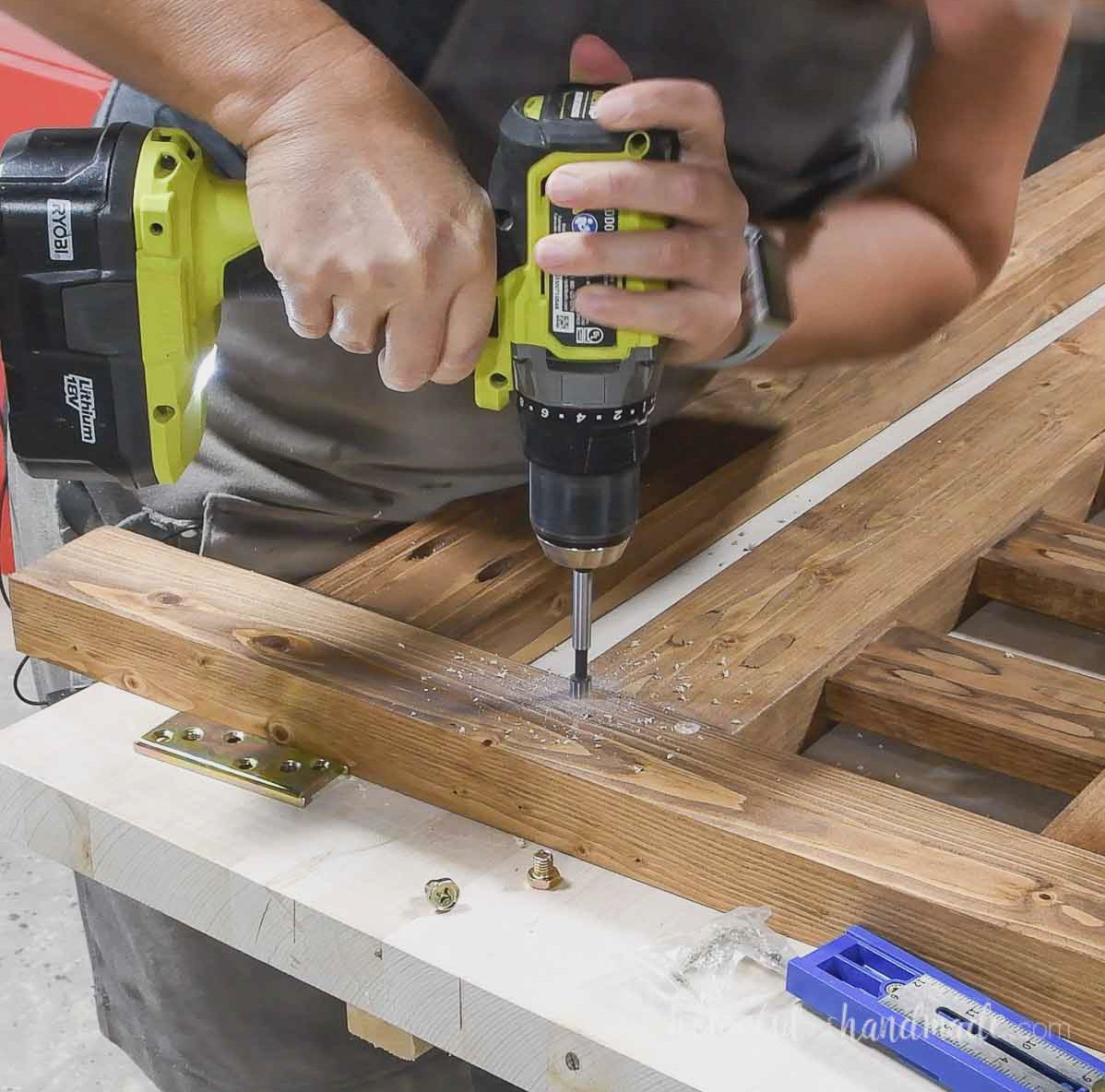 Drilling holes for the tightening bolts on the bed rail brackets. 