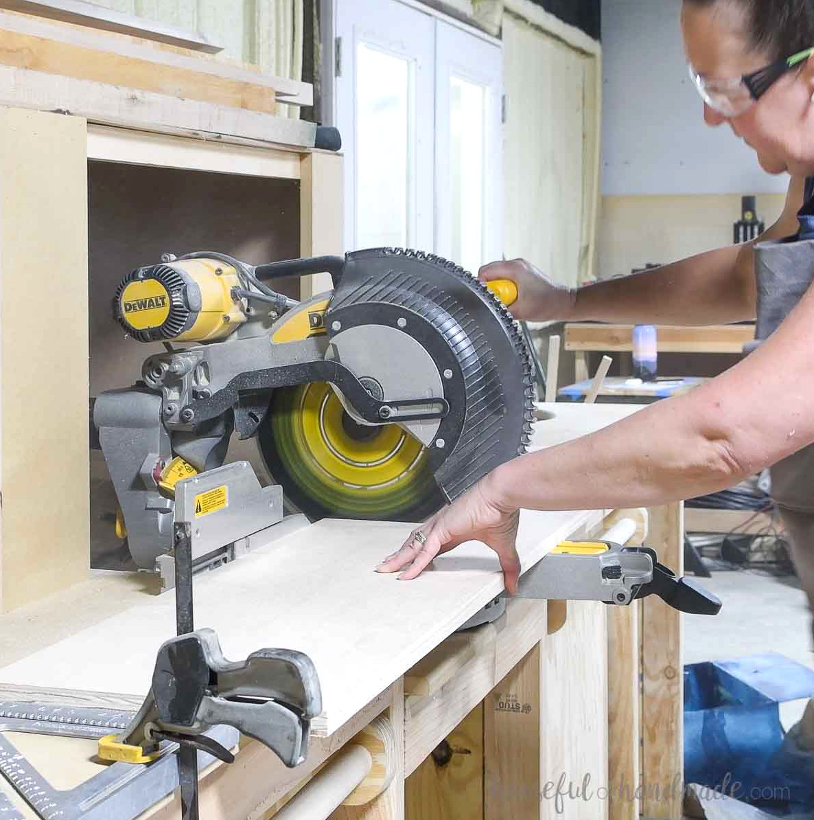 Cross-cutting bookcase pieces with a sliding miter saw.