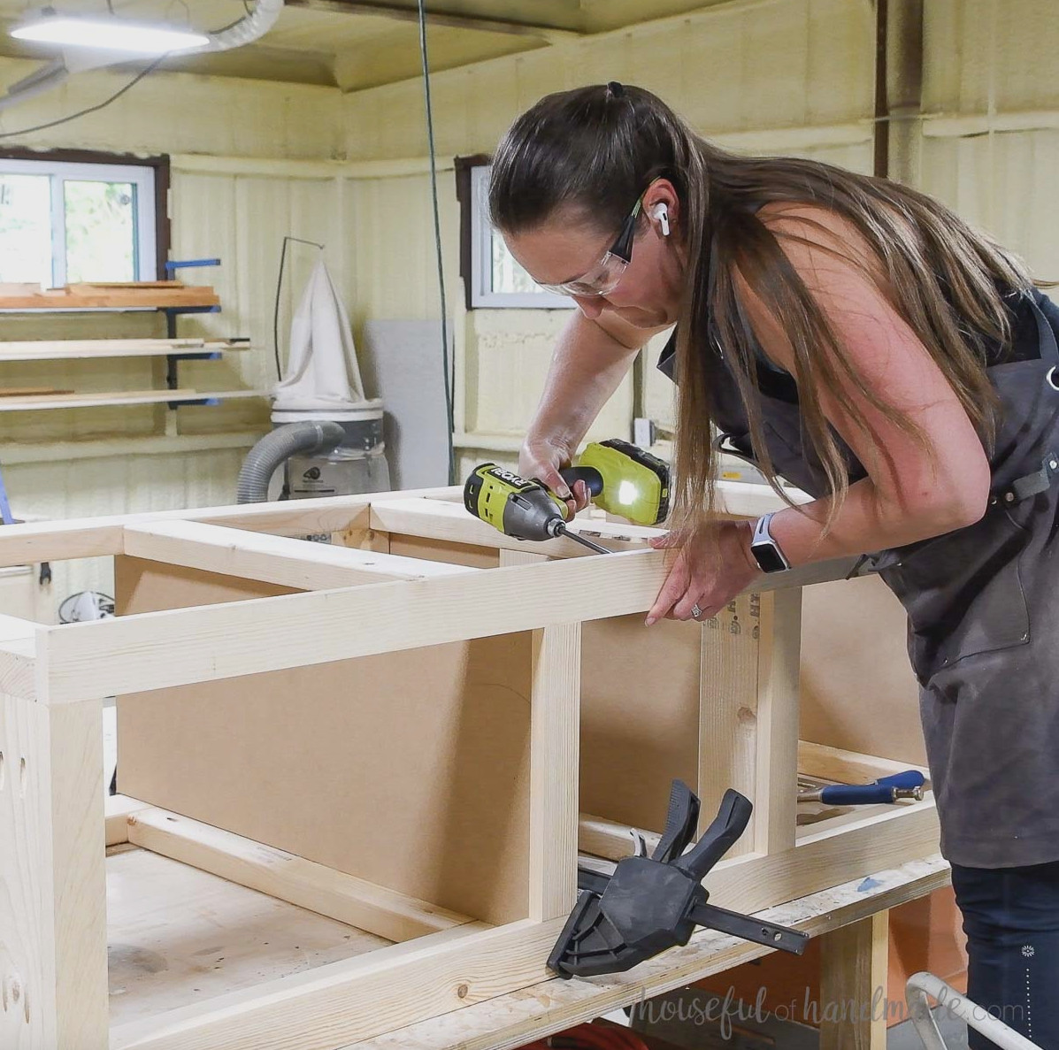 Attaching the front of the laundry platform with pocket hole screws. 