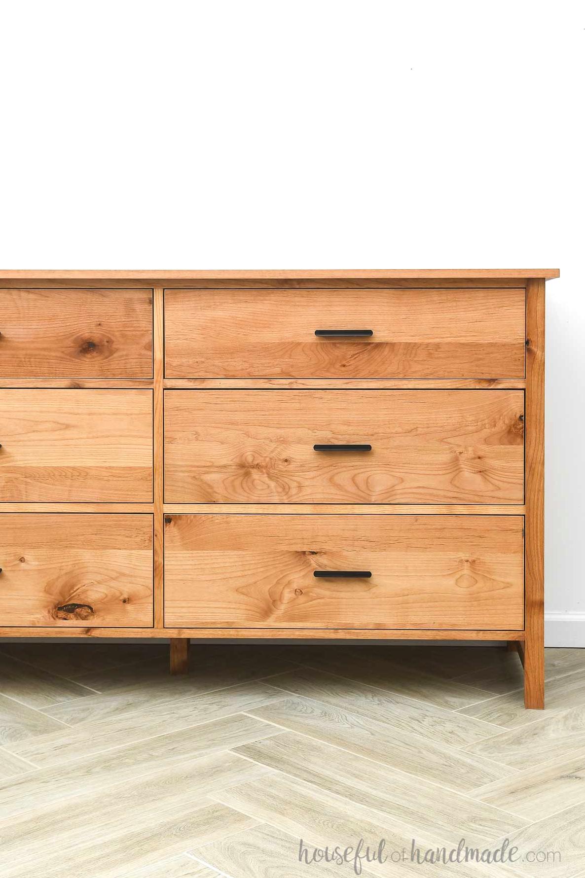 Broad DIY alder dresser with six drawers and black drawer pulls.