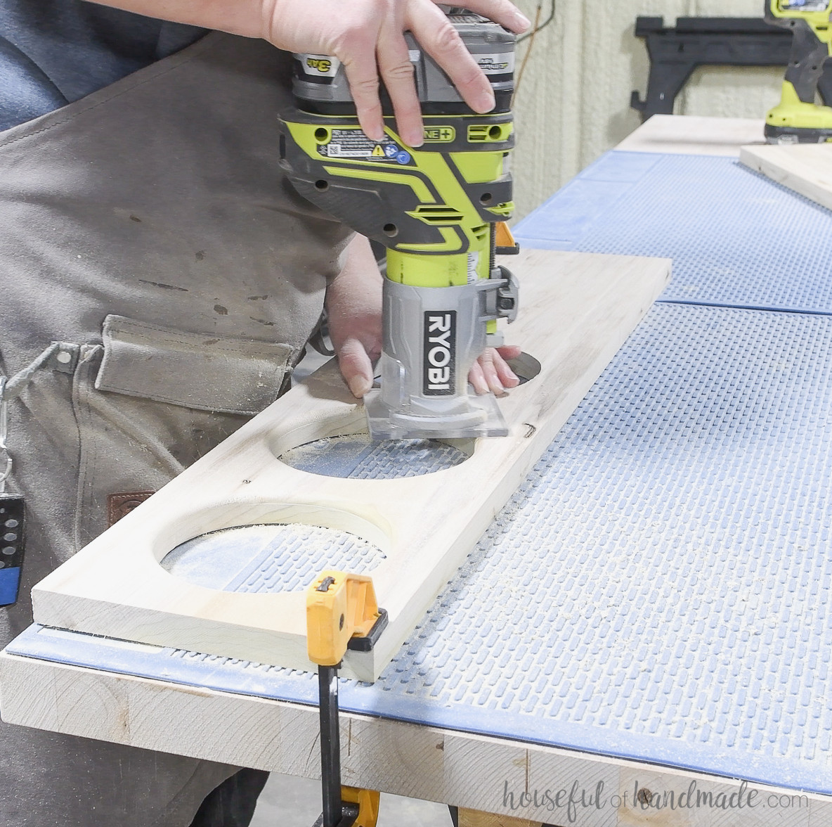 Adding a round over to the cut out circles with a trim router. 