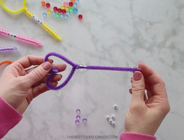 Place Pony Beads on Pipe Cleaners