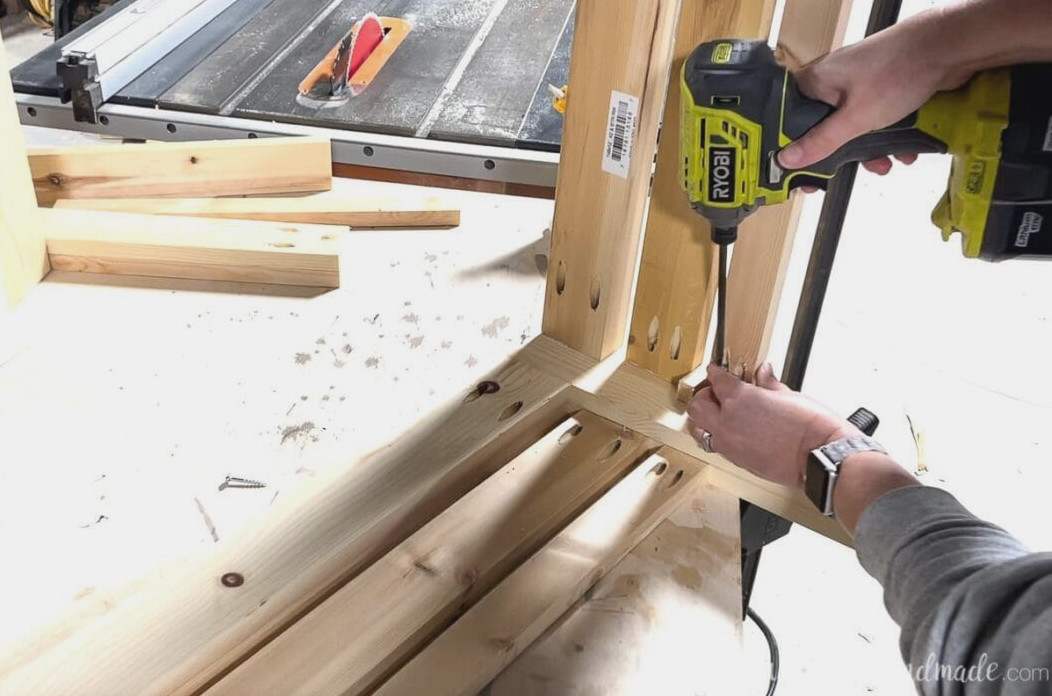 Using pocket holes to attach the side skirt and decorative pieces to the front. 