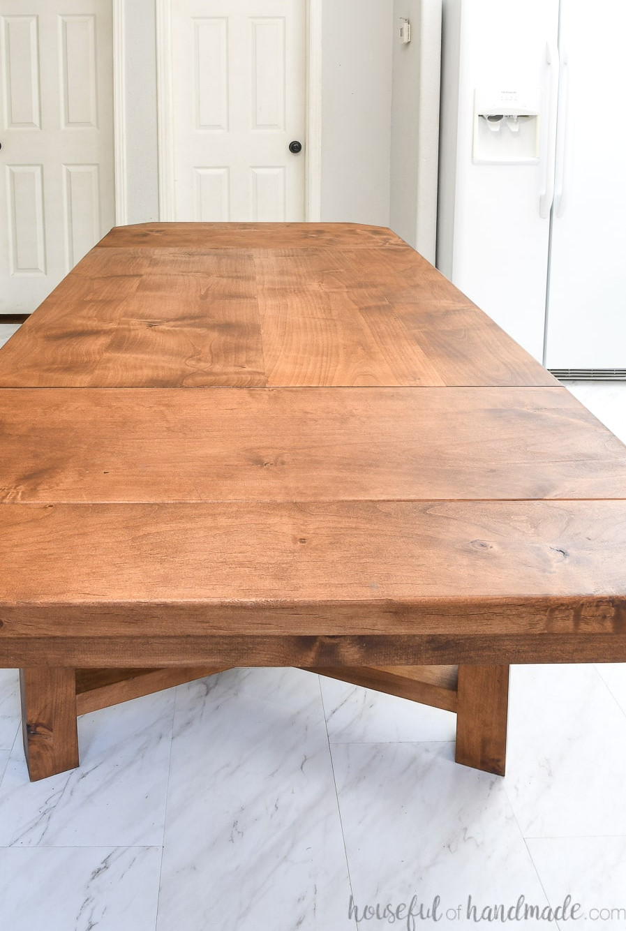 View from above of the tabletop with both leaves attached, showing the Chestnut TrueTone finish on the alder table. 