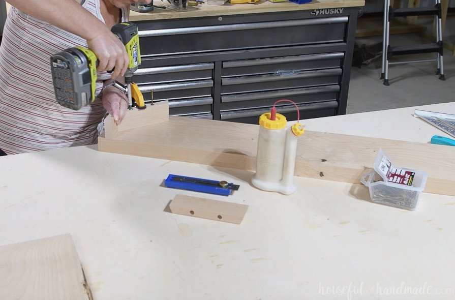 Securing the side skirt pieces to the breadboard end. 
