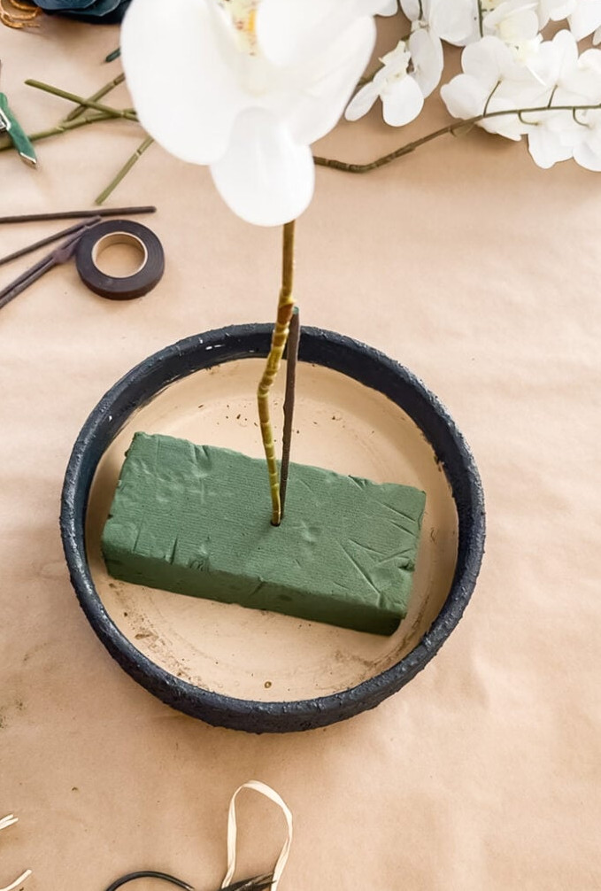 a planter with floral foam