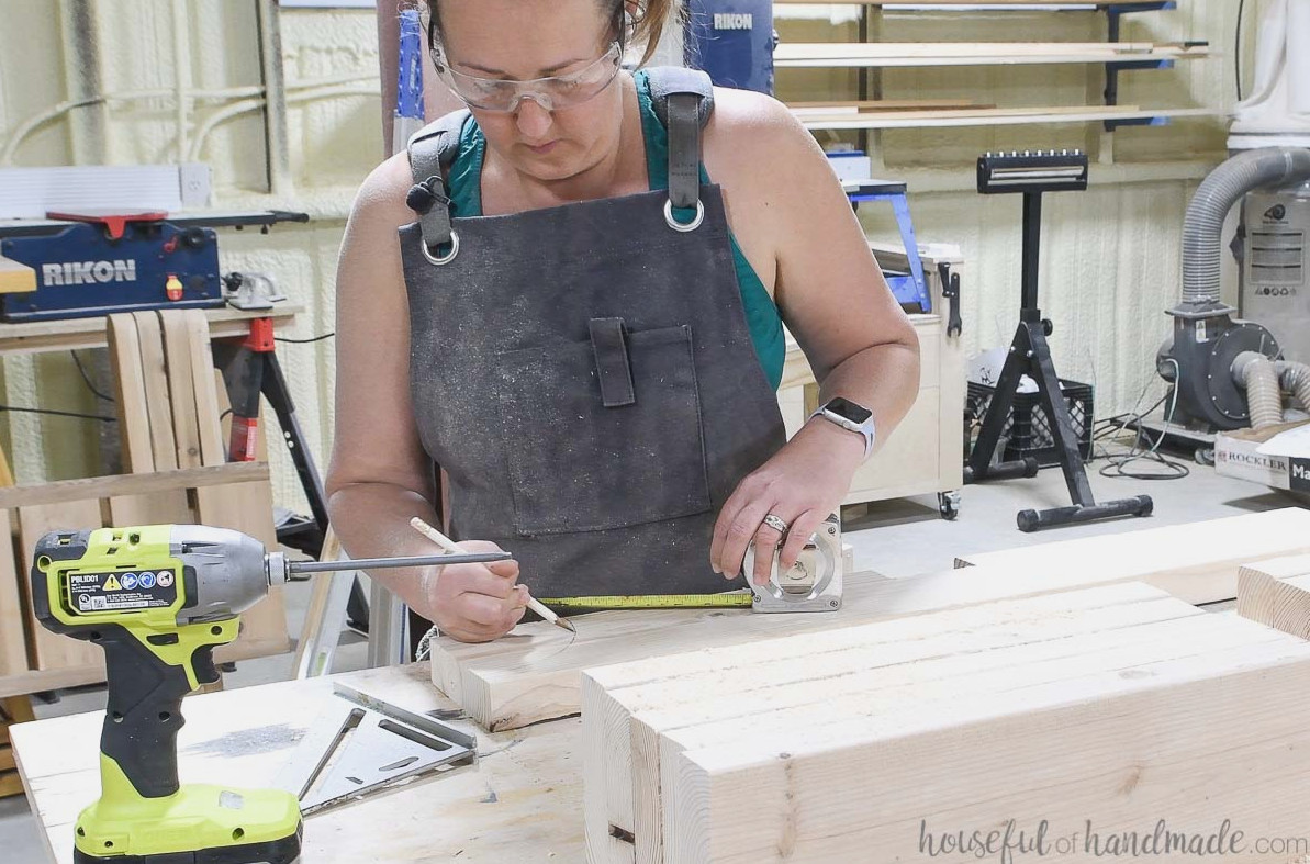 Marking the curve along the sides of the pergola rafter boards.