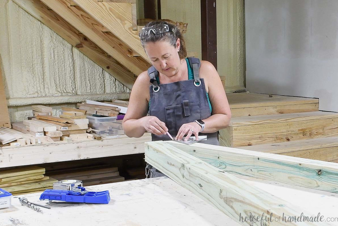 Marking the line for the angled cut with a speed square.