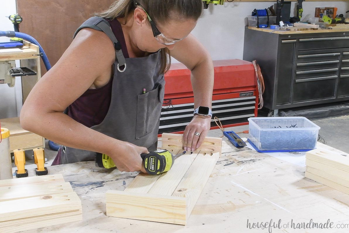 Attaching the bottom board for the planter frames to the sides with pocket holes.